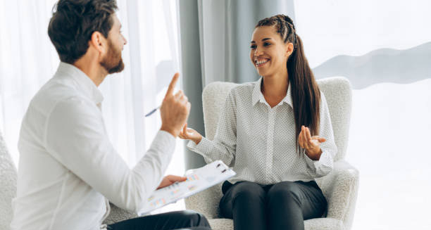 Smiling woman in therapy session showing positive outlook for health anxiety recovery