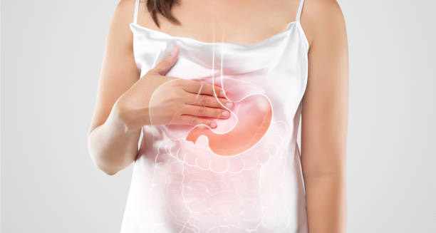 Woman holding chest with digestive illustration showing hiatus hernia condition