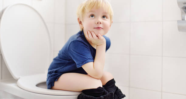 Young child sitting on toilet, representing recovery outlook for Hirschsprung’s disease
