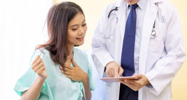 Doctor discussing prognosis with a smiling patient recovering from idiopathic pulmonary fibrosis