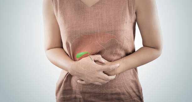 Woman clutching abdomen with a gallbladder illustration superimposed