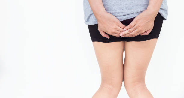 Woman showing discomfort from symptoms of haemorrhoids
