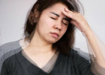 Woman experiencing dizziness and fatigue from hypoglycaemia
