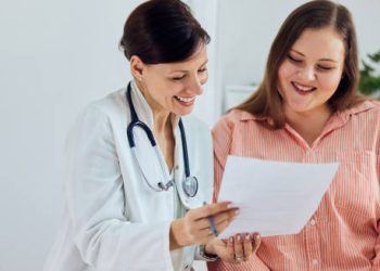 Doctor and patient reviewing treatment plan for food colour sensitivity
