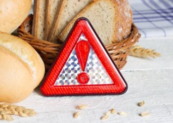 Bread and warning sign indicating food intolerance or gluten sensitivity