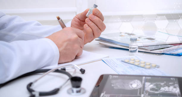 Doctor preparing injectable medication for vascular disorder treatment