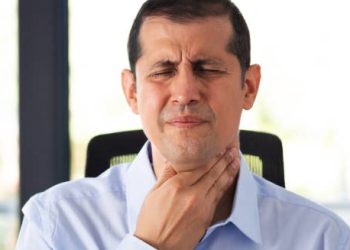 Man holding throat in pain – Treatment of Glandular Fever
