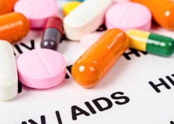 Antiretroviral HIV medication on HIV/AIDS label background