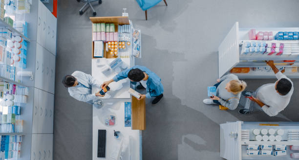 Pharmacist assisting a customer in selecting treatment for hair dye reactions.