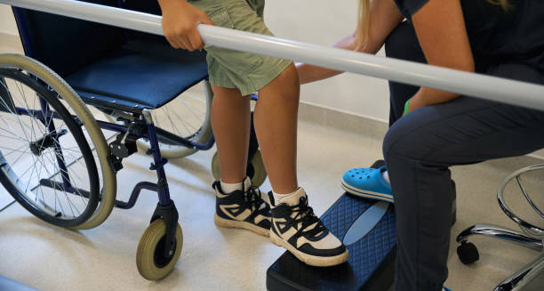 Child receiving physical therapy for hereditary spastic paraplegia rehabilitation