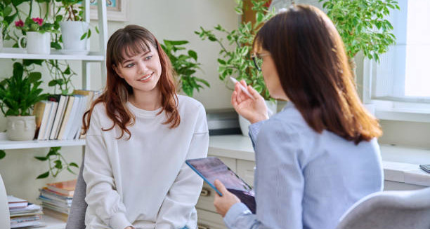 Smiling woman in therapy session receiving treatment for hoarding disorder