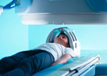 Child undergoing MRI scan as part of hydrocephalus treatment and monitoring.