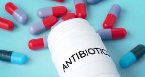 Antibiotic capsules and medicine bottle labelled for idiopathic pulmonary fibrosis treatment
